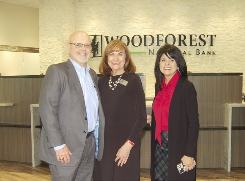 Pictured at the soft opening of the newly re-built Woodforest National Bank building in Downtown Conroe are bank representatives Jay Dreibelbis, President and CEO; Linda O'Dell, Conroe Downtown Branch Manager; and Patricia Brown, President of Conroe. (Photo by Liz Grimm)