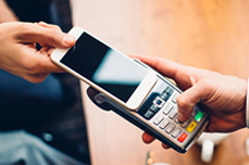 Person paying with a mobile phone